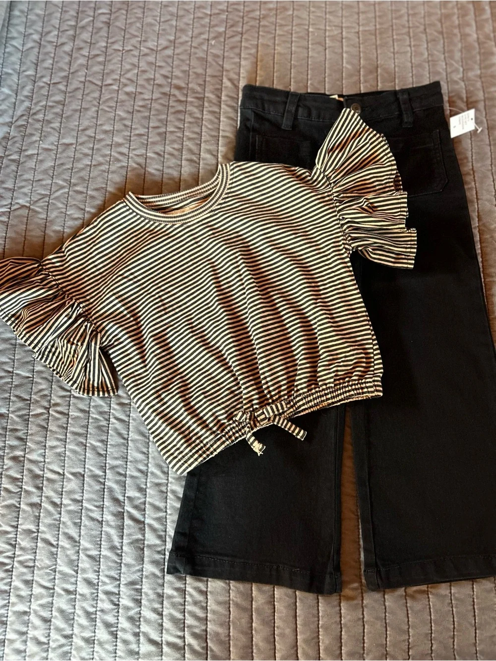Jessica Simpson Black & Cream Striped Knit Top & black jeans